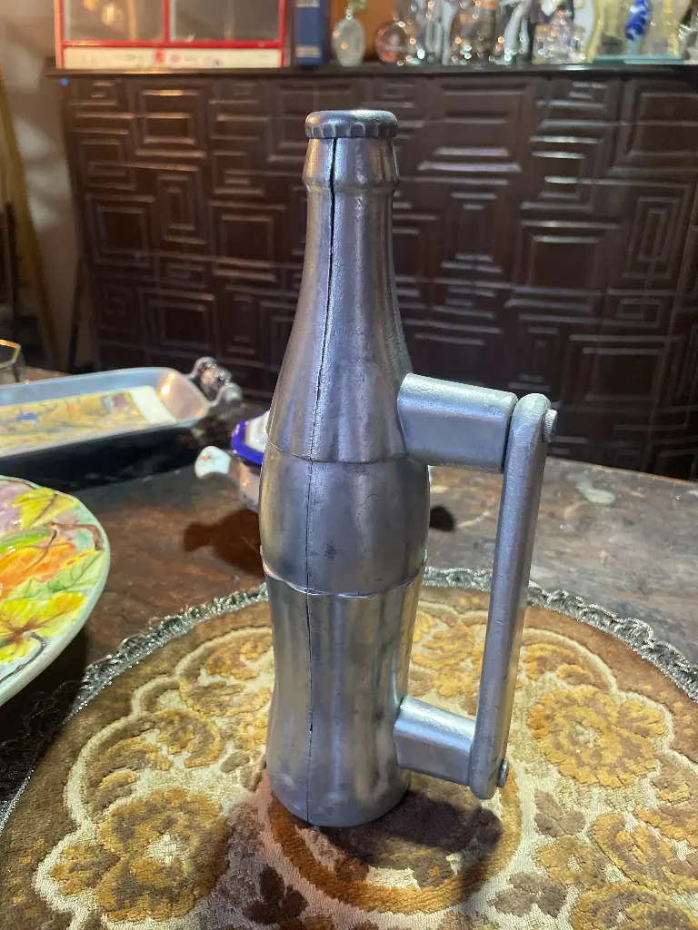 Manija y destapador botella Coca Cola