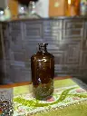 Botella ambar tapón en vidrio